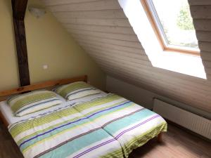 Postel nebo postele na pokoji v ubytování Apartmán Slezská Harta