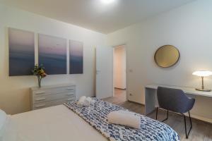 A bed or beds in a room at CASA VERA Tra storia, mare e comodità