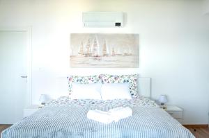 a bedroom with a bed with two towels on it at Villa the View Zagore in Brseč +37 photos