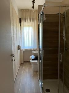 Et badeværelse på Sport Hotel & Residence Il Bivacco del Parco