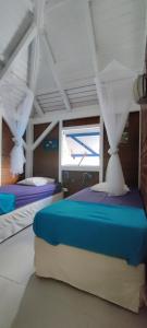 Postel nebo postele na pokoji v ubytování Habitation Colas