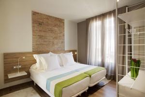 Katil atau katil-katil dalam bilik di Barcelona Apartment Milà