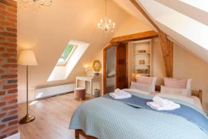 a bedroom with a large bed in a attic at Trevilles Art-Deco Józefina in Szklarska Poręba