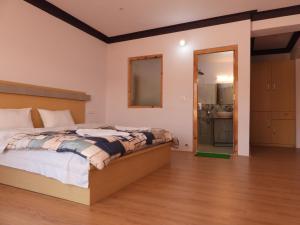 Ένα ή περισσότερα κρεβάτια σε δωμάτιο στο Babu Guest House
