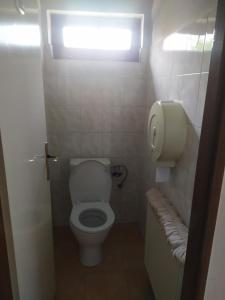 a small bathroom with a toilet and a window at Ubytování U Jarky in Český Krumlov +3 photos