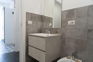 a bathroom with a sink and a toilet at Zagara e Lumia in Catania
