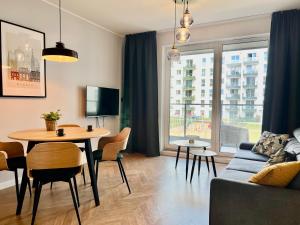 TV a/nebo společenská místnost v ubytování Apartamenty Angielska Grobla Q4Apartments