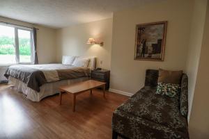 מיטה או מיטות בחדר ב-Atlantic Motel