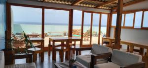 a living room with a view of the ocean at Casa D'Mar in Ponta do Sol