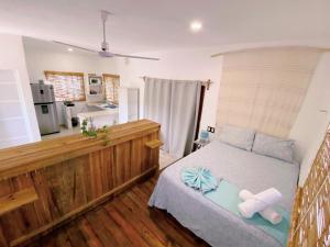 a bedroom with a bed with two pillows on it at Casa Gonza by Holbox Rents in Holbox Island