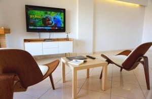 A television and/or entertainment centre at Piraeus Bright Apt