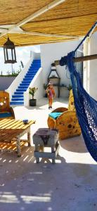 a room with a hammock and a staircase at l' Escapade 