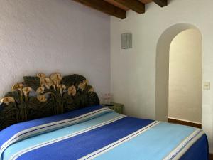 Postel nebo postele na pokoji v ubytování Casa Árbol Hotel