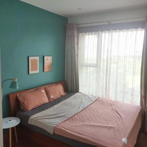 En eller flere senge i et værelse på Hoàng Linh
