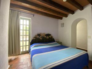 Postel nebo postele na pokoji v ubytování Casa Árbol Hotel