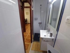 a bathroom with a white sink and a mirror at Marblava 1 in Vinarós