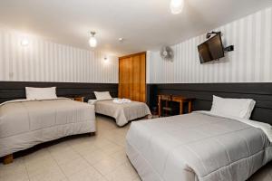 Ліжко або ліжка в номері Miraflores Suites Centro