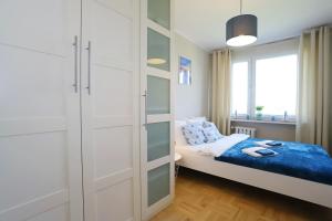 Katil atau katil-katil dalam bilik di Apartament Stara Latarnia