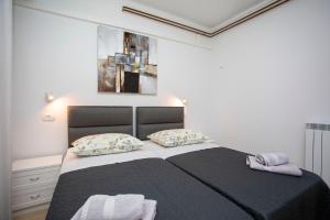Postel nebo postele na pokoji v ubytování Apartmani Marica