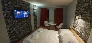 Łóżko lub łóżka w pokoju w obiekcie Villa Eden & Restaurant