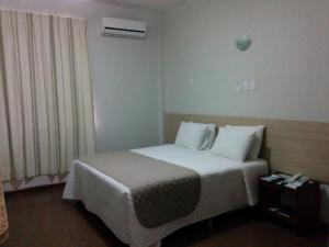 En eller flere senge i et værelse på Itabuna Palace Hotel