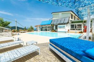 a villa with a swimming pool and a house at Mediterraneo Relais - Gym, Pool & SPA in Agropoli