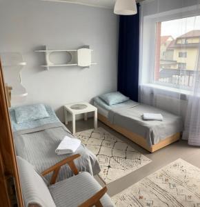 Postel nebo postele na pokoji v ubytování Prestige 2