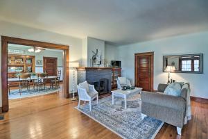 a living room with a couch and a fireplace at Historic Mountain Home Haven with Large Yard! in Mountain Home