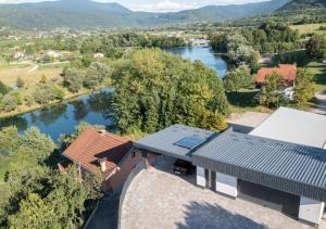 an aerial view of a house with a river at Villa Kula in Bihać