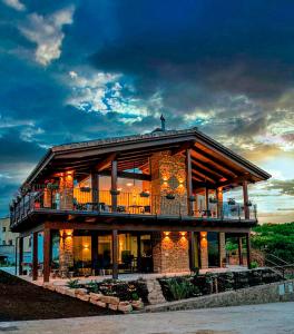 a large house with a deck on the beach at Casa Nahia Hostal Rural in Lorca