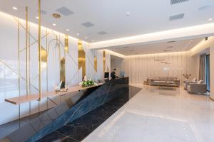 a lobby of a hotel with a reception desk at GRAND PATELLI in Myrina