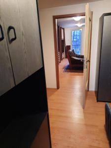 a hallway with a door leading to a living room at Ferienwohnung Süß in Kovanluk