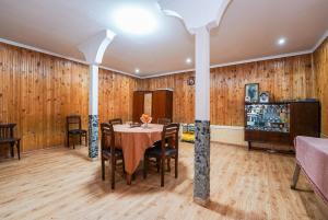 a dining room with a table and chairs at Bori's Guesthouse in Ushguli
