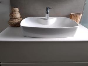 a white sink on a white counter in a bathroom at Casa Lagada Kos Private Residence. in (( Kermetés )) +37 photos