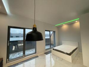 Postel nebo postele na pokoji v ubytování Apartament Centrum