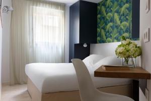 Posteľ alebo postele v izbe v ubytovaní Hotel Alcyon
