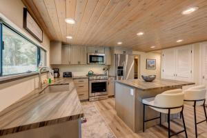a kitchen with a sink and a counter top at Relaxation on Muletail in Carnelian Bay