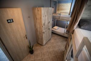 A bed or beds in a room at Bedway Athens Hostel