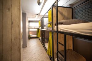 A bed or beds in a room at Bedway Athens Hostel