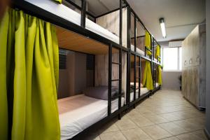 A bed or beds in a room at Bedway Athens Hostel
