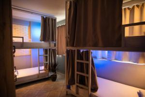 A bed or beds in a room at Bedway Athens Hostel