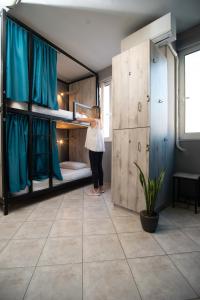 A bed or beds in a room at Bedway Athens Hostel