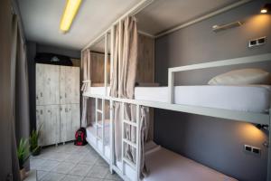 A bed or beds in a room at Bedway Athens Hostel