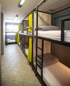 A bed or beds in a room at Bedway Athens Hostel
