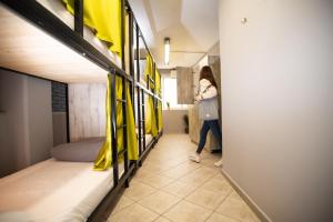 A bed or beds in a room at Bedway Athens Hostel