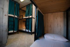 a bedroom with two bunk beds in a room at Bedway Athens Hostel in Athens