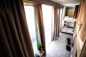 A bed or beds in a room at Bedway Athens Hostel