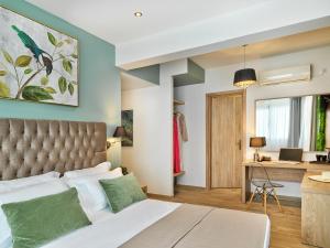 a bedroom with a bed and a desk at ACROPOLIS CITY LIFE BOUTIQUE HOTEL in Athens