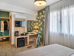 Ein Bett oder Betten in einem Zimmer der Unterkunft Acropolis City Life BH