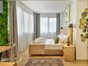 Ein Bett oder Betten in einem Zimmer der Unterkunft Acropolis City Life BH